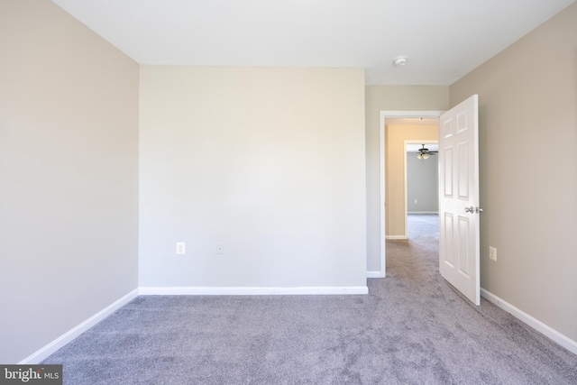 unfurnished room featuring light colored carpet