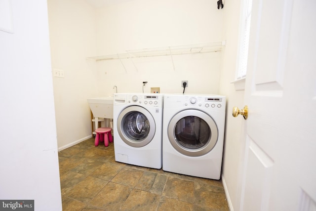 washroom featuring washing machine and clothes dryer