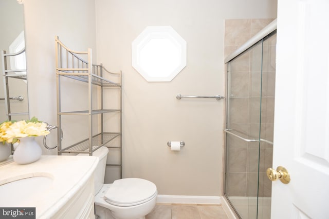 bathroom with an enclosed shower, tile patterned floors, vanity, and toilet