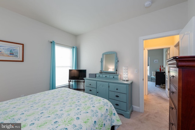 bedroom with light colored carpet