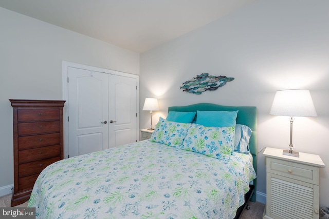 carpeted bedroom featuring a closet