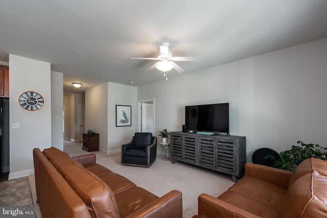 living room featuring light colored carpet and ceiling fan