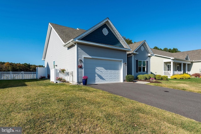 view of front of house with a front lawn and a garage