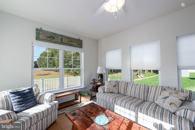 living room featuring a healthy amount of sunlight and ceiling fan