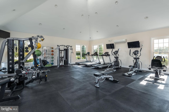 gym with a wall mounted AC and plenty of natural light