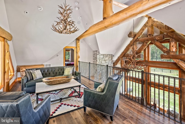 sitting room with wood-type flooring, high vaulted ceiling, and beam ceiling