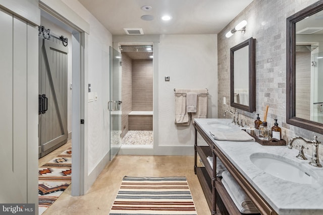 bathroom featuring an enclosed shower and vanity