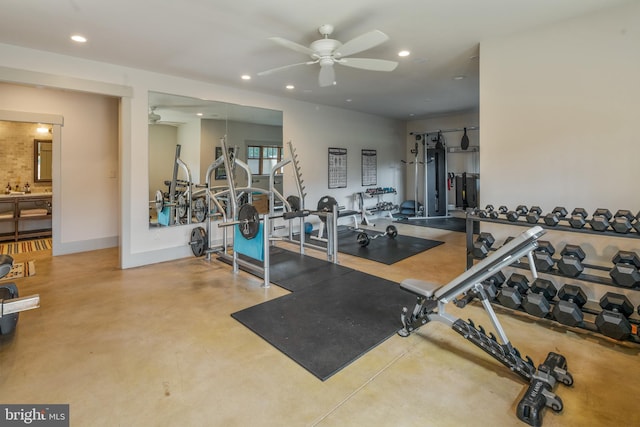 gym featuring ceiling fan and concrete floors