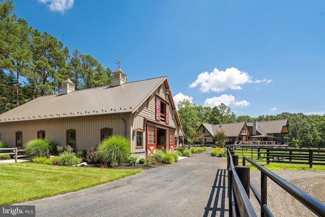 view of side of property with a lawn