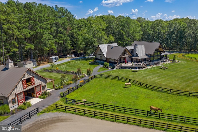 birds eye view of property featuring a rural view