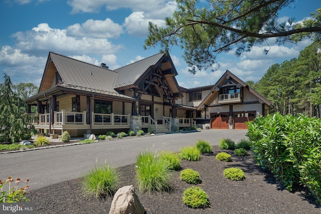 exterior space featuring a porch and a garage