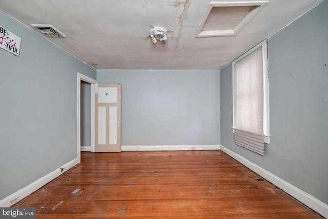 spare room with dark hardwood / wood-style floors