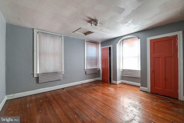 interior space featuring ceiling fan and hardwood / wood-style flooring