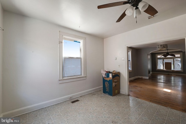 empty room featuring ceiling fan and wood-type flooring