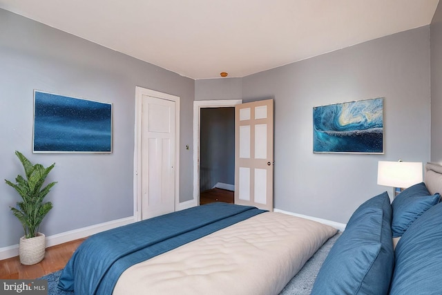 bedroom with wood-type flooring