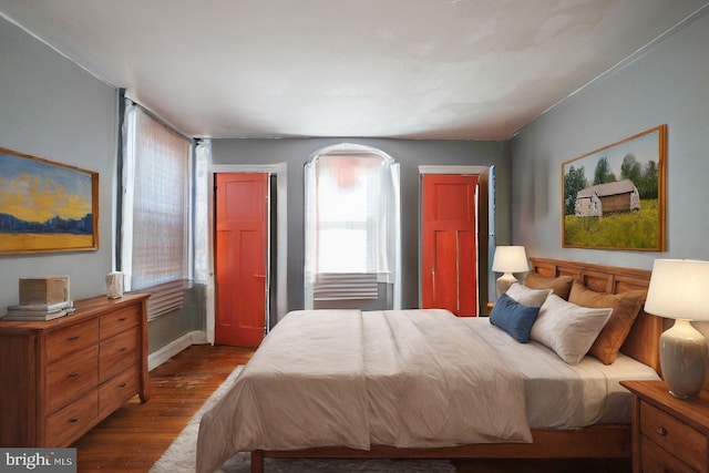 bedroom with hardwood / wood-style floors