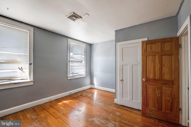 unfurnished bedroom with wood-type flooring