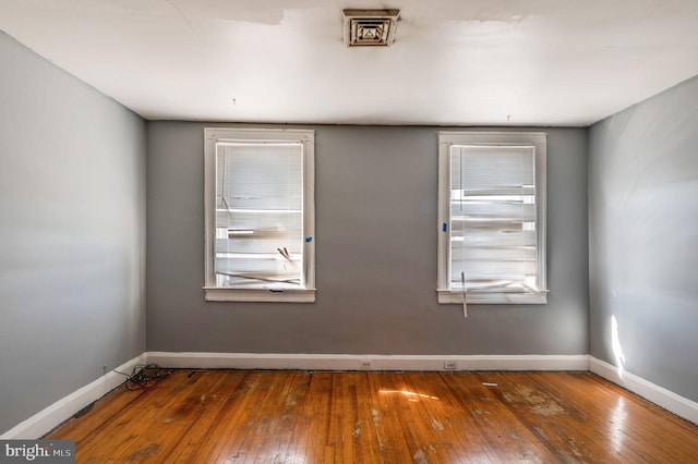 empty room featuring dark wood-type flooring