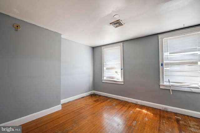 empty room featuring hardwood / wood-style floors