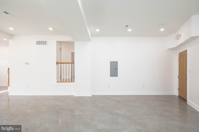 unfurnished room featuring electric panel