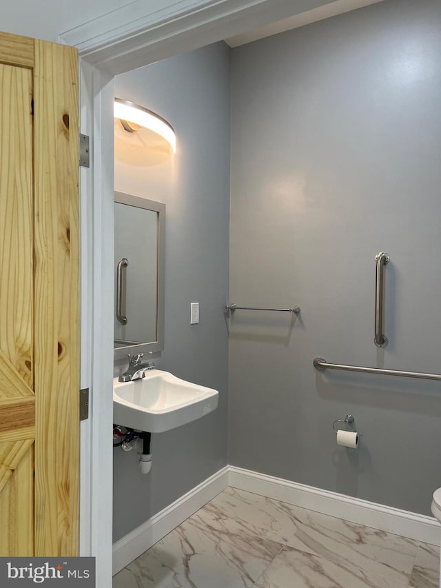 bathroom with toilet and sink