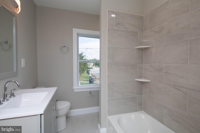 full bathroom featuring tile patterned floors, a healthy amount of sunlight, toilet, and vanity