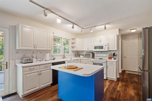 kitchen featuring tasteful backsplash, white appliances, a kitchen island, dark hardwood / wood-style floors, and white cabinetry