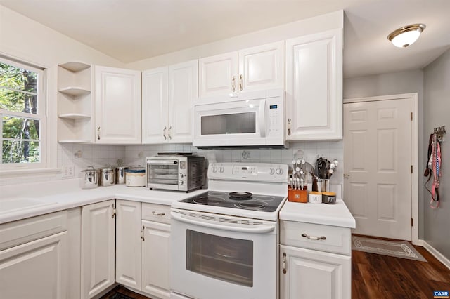 kitchen featuring tasteful backsplash, white appliances, and white cabinets