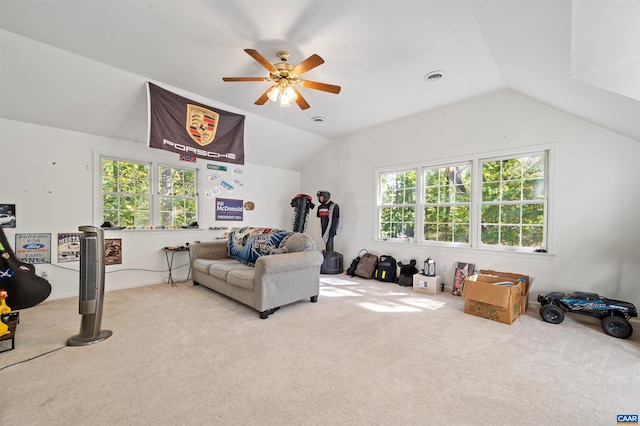 living room featuring ceiling fan, light colored carpet, and vaulted ceiling