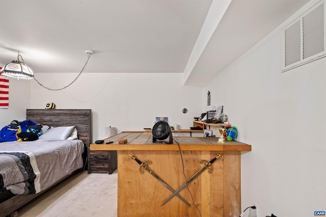 bedroom featuring light colored carpet