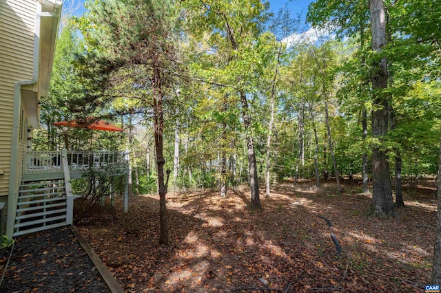 view of yard with a wooden deck