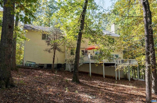 view of home's exterior with a wooden deck