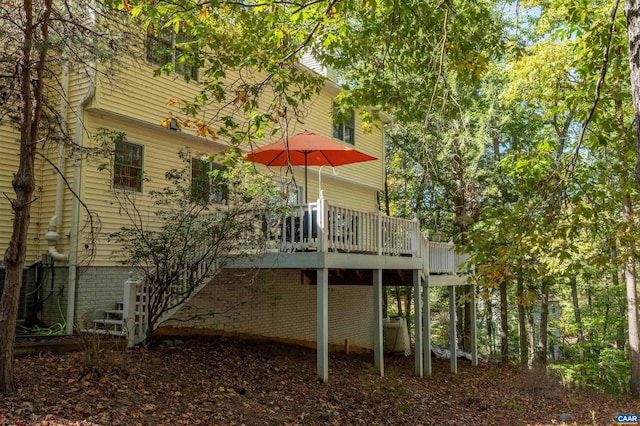 back of house featuring a deck