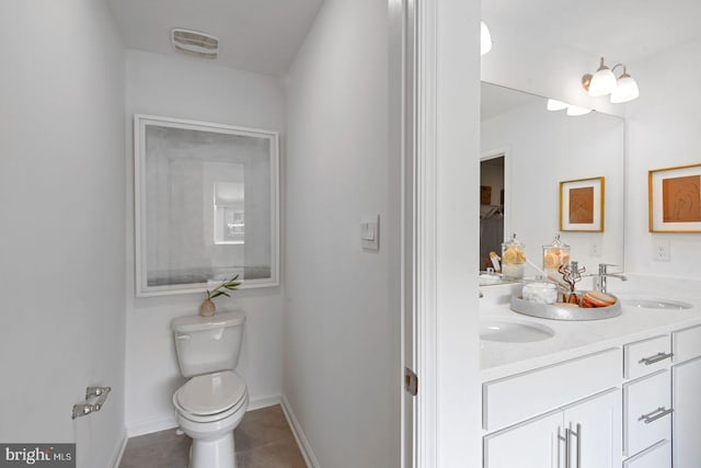 full bathroom featuring visible vents, toilet, a sink, tile patterned floors, and baseboards