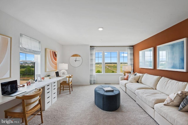 living room with light colored carpet and baseboards