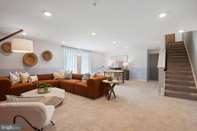 living room with light carpet, recessed lighting, stairway, and baseboards
