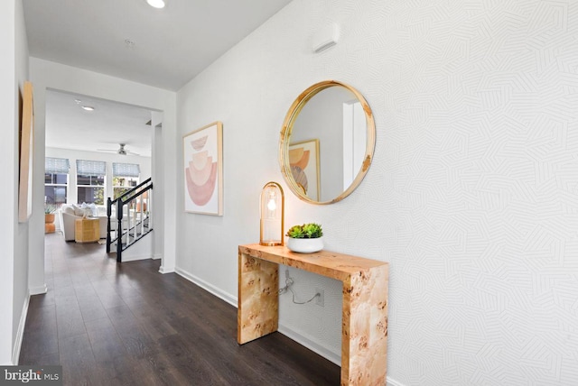 hallway with recessed lighting, stairs, dark wood-type flooring, and baseboards
