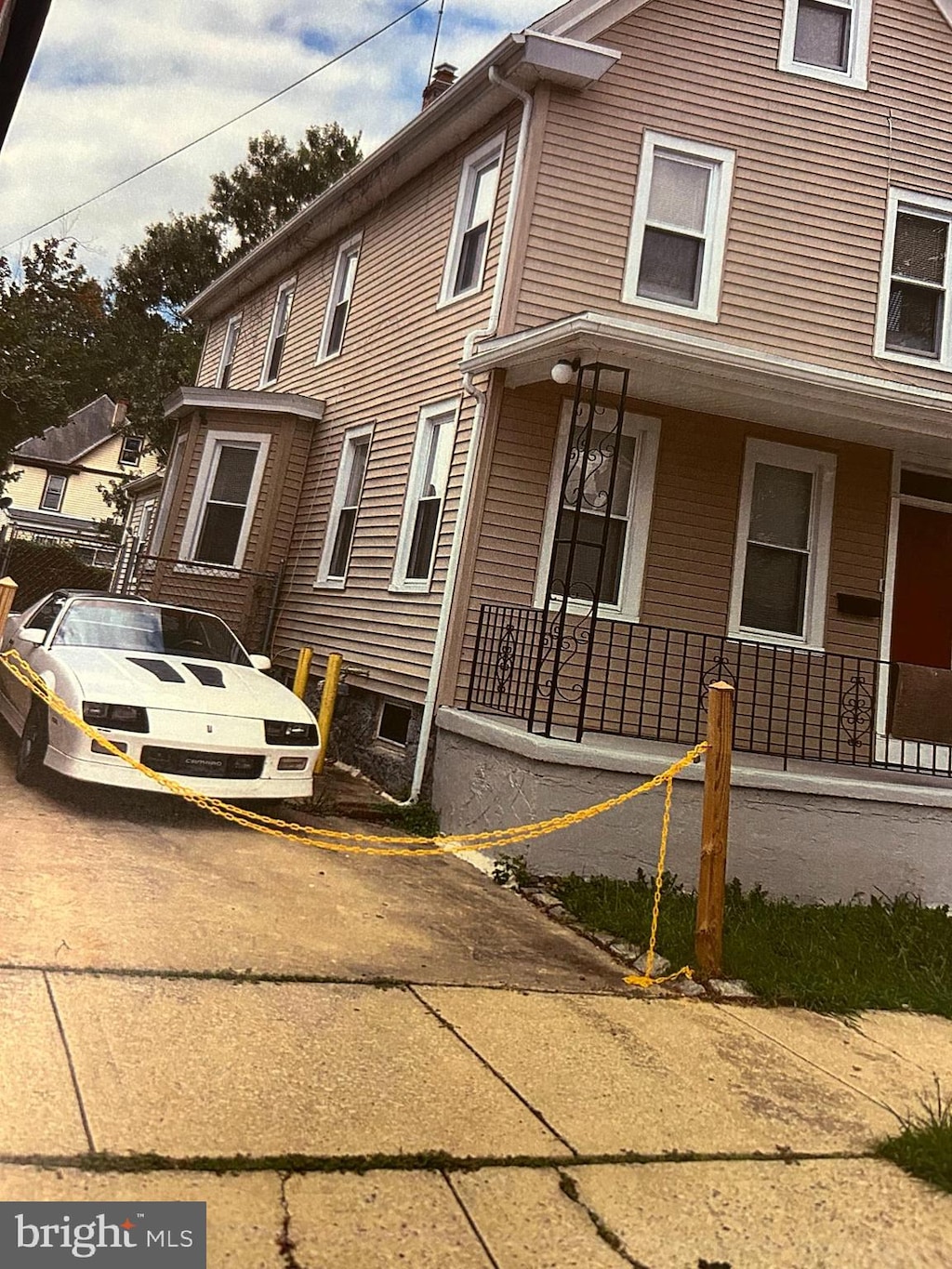 view of side of home featuring a porch