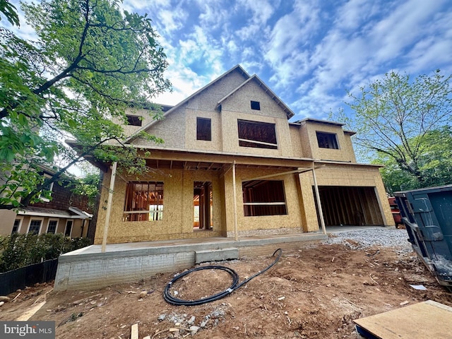unfinished property with a porch and stucco siding