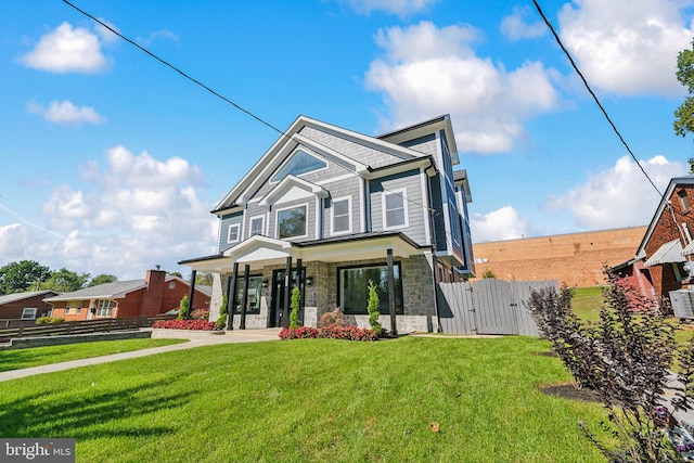 view of front of property with a front lawn and covered porch