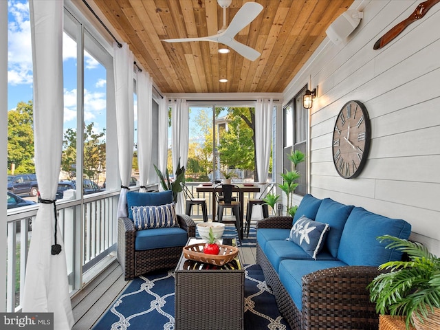 sunroom / solarium with wood ceiling and ceiling fan