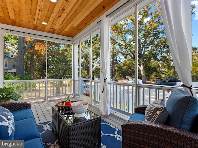 sunroom / solarium featuring wooden ceiling