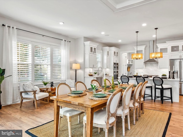 dining space featuring a chandelier and light wood-type flooring