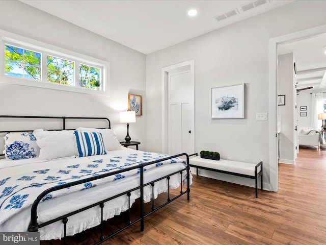 bedroom featuring hardwood / wood-style floors