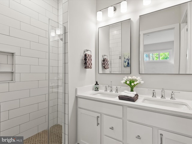 bathroom with walk in shower and vanity