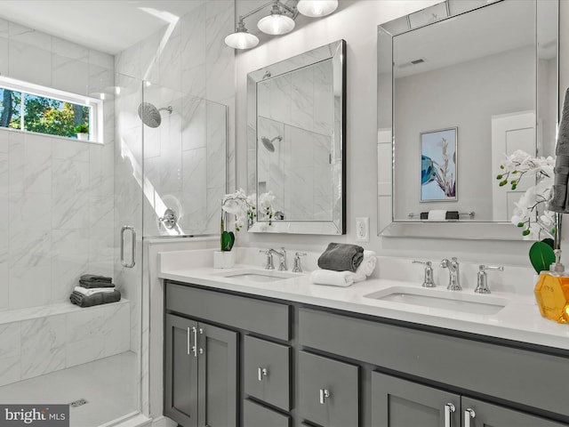 bathroom featuring vanity and an enclosed shower