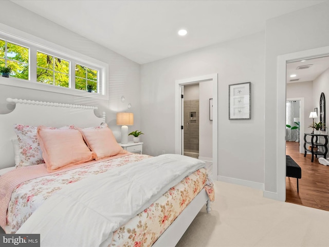 bedroom featuring light colored carpet