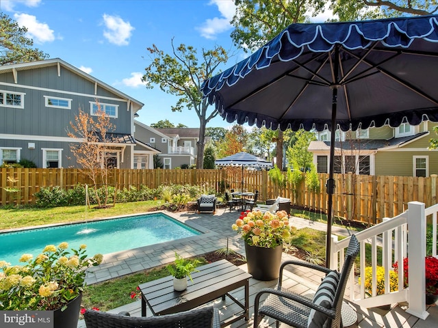 view of swimming pool featuring a patio area