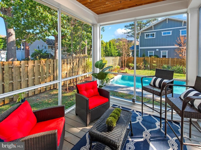 sunroom / solarium featuring wood ceiling