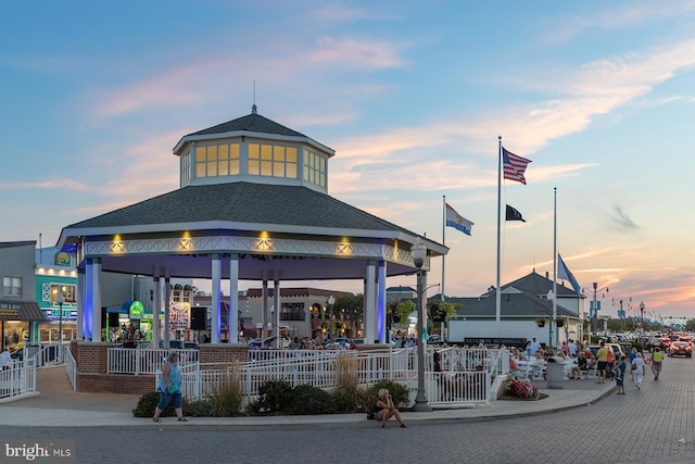 view of outdoor building at dusk